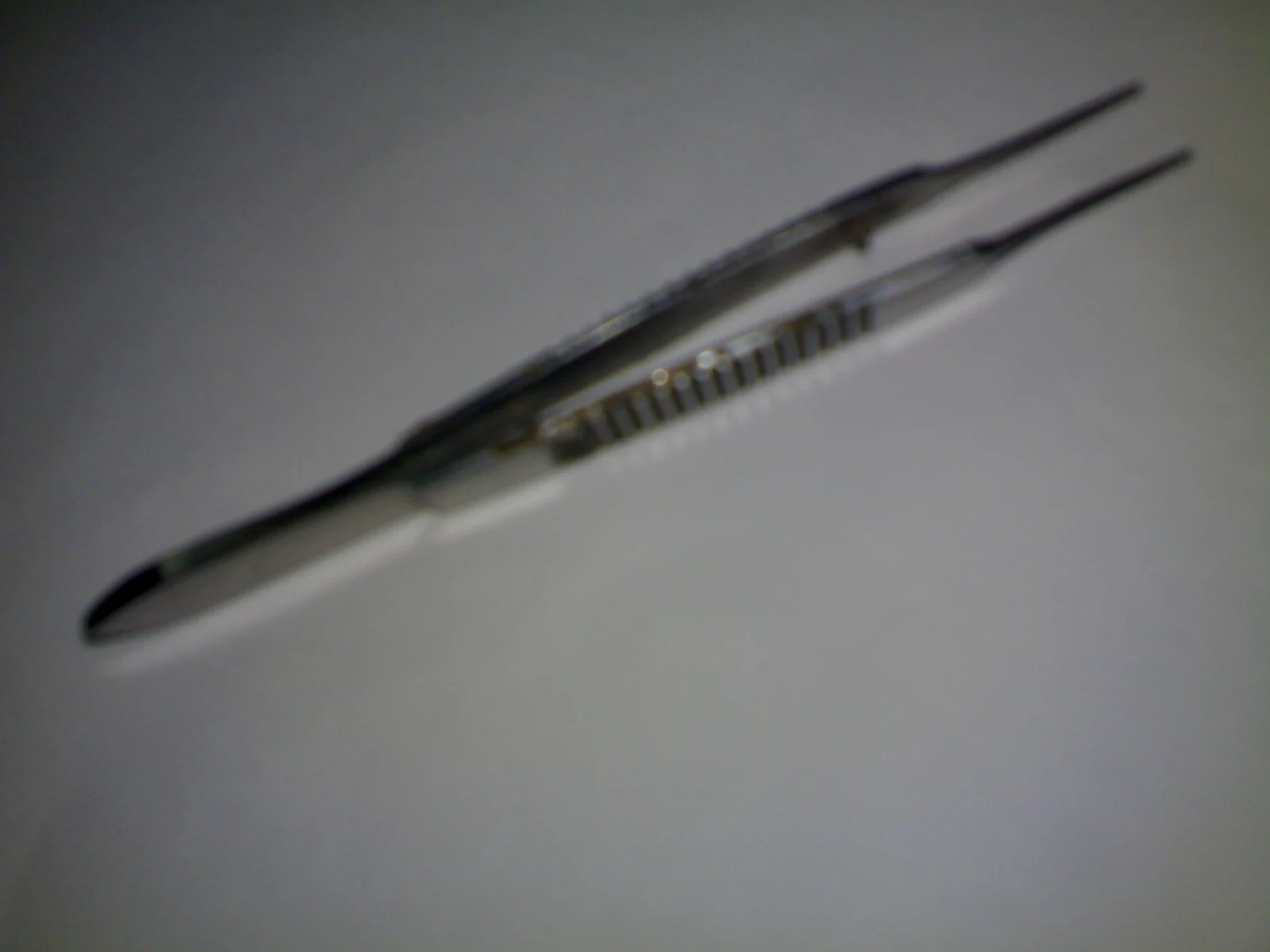Suture-tying forceps — reference view